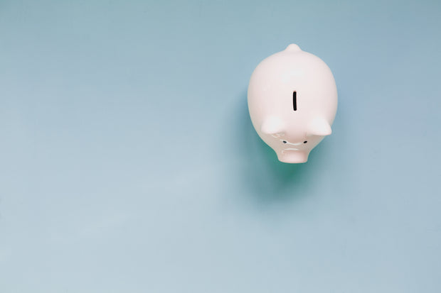 Piggy bank on blue background  