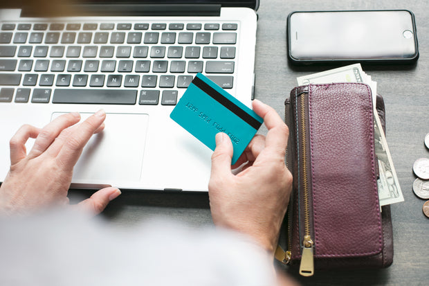 business style photo, paying by card on a notebook
